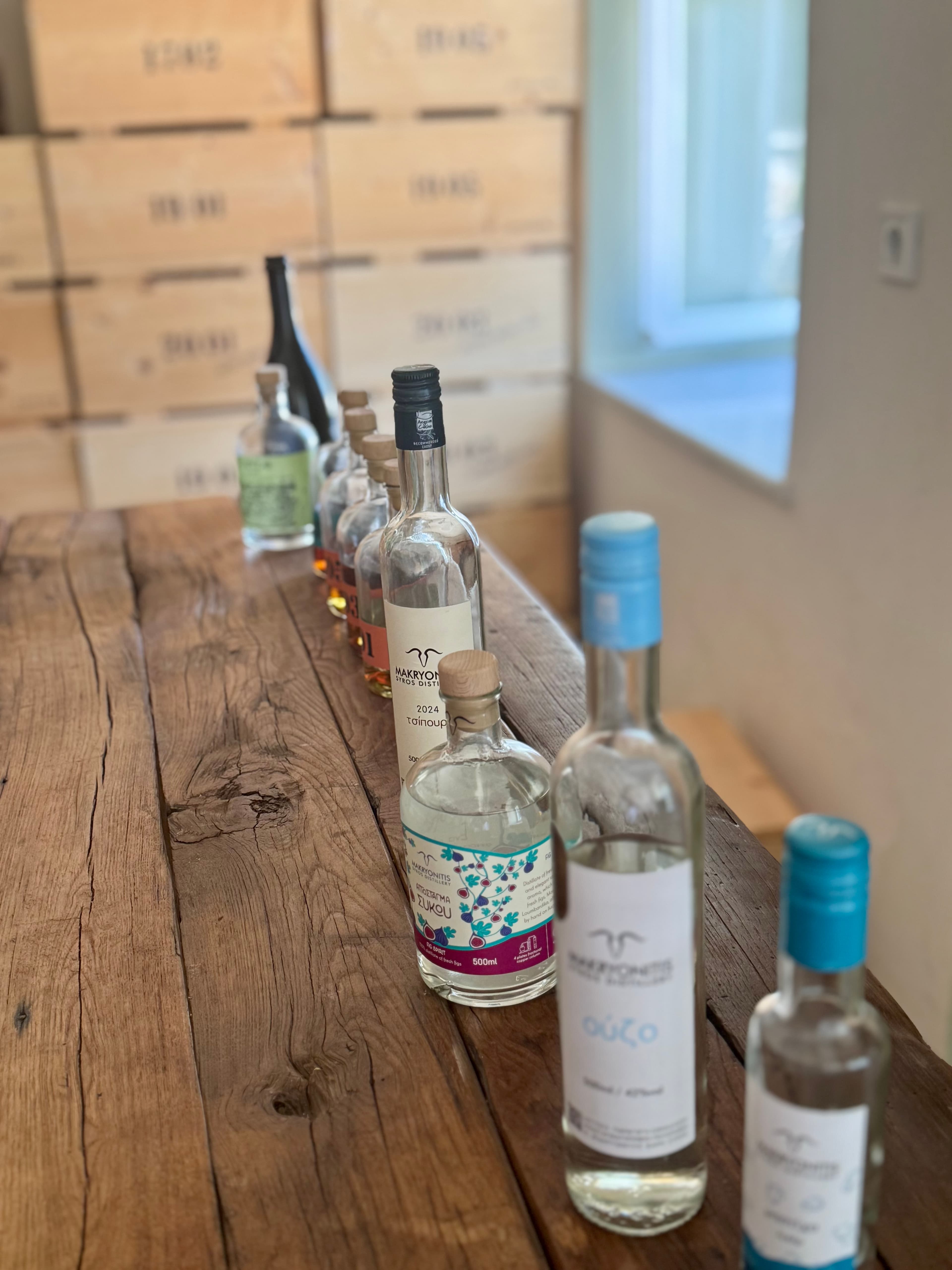 Bottles from the distillery, highlighting the delicious fig distillate and tsipouro.