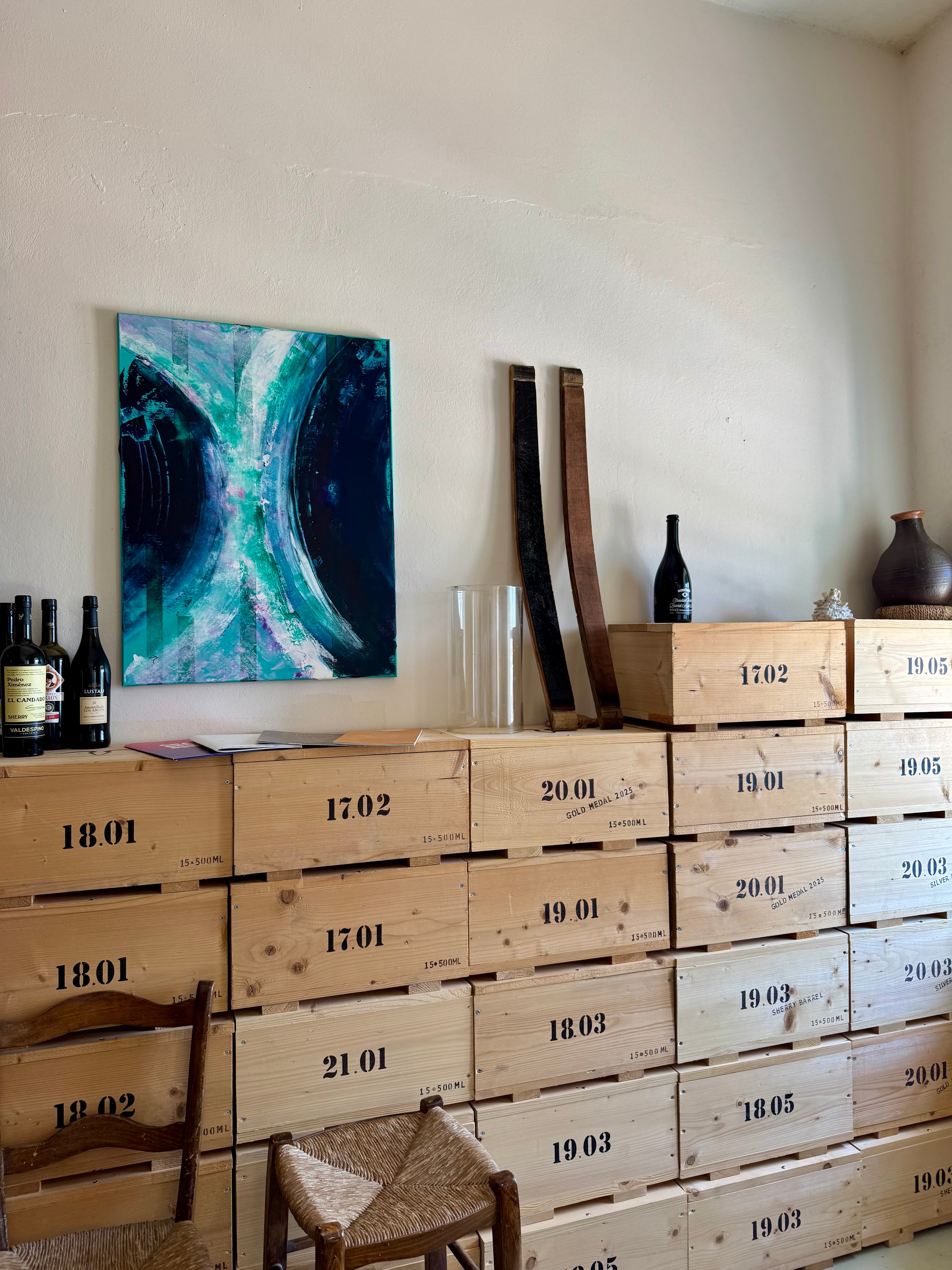 Boxes containing bottles of aged tsipouro, labeled with the year of distillation and the number of years of aging.