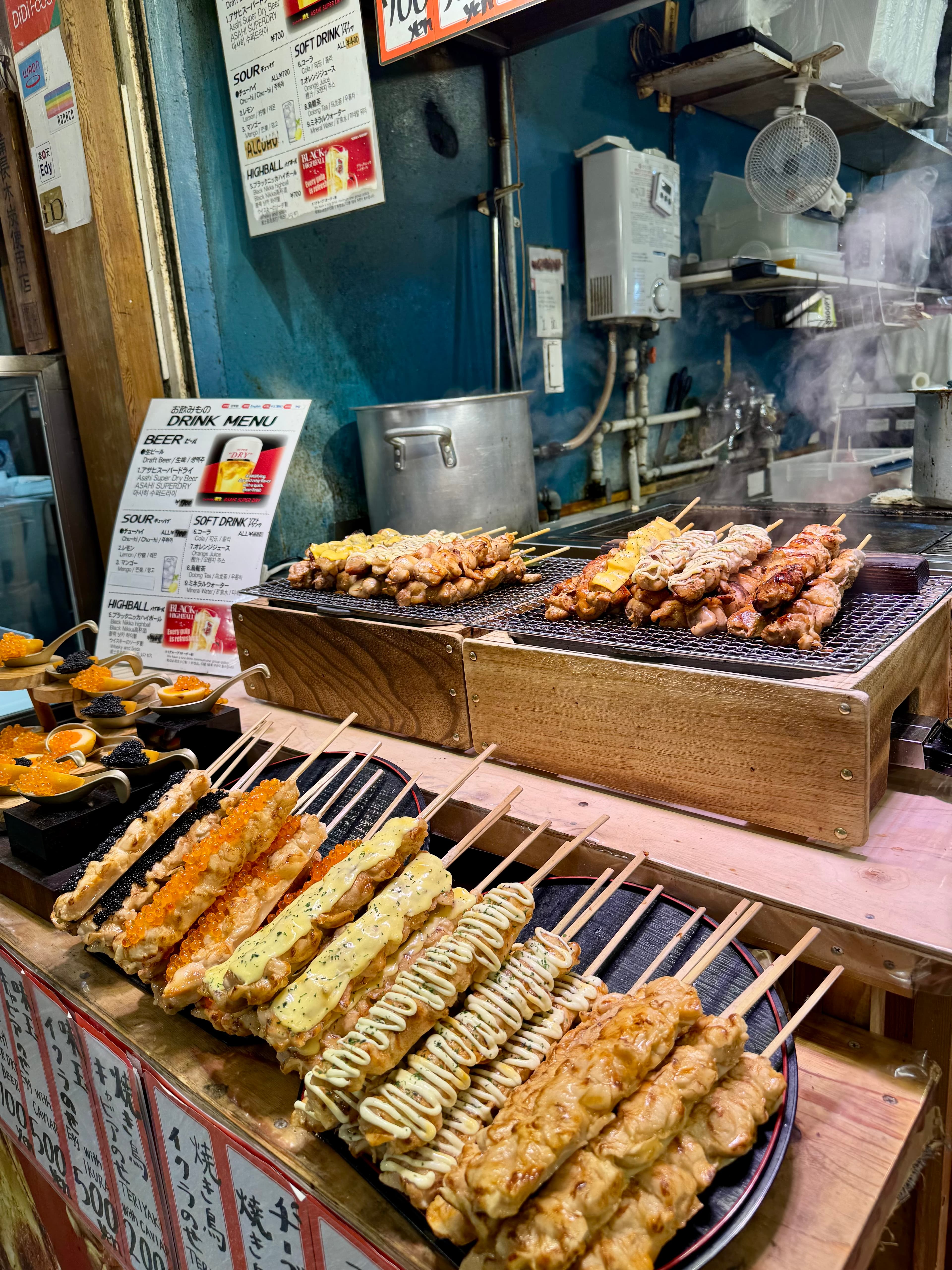 Grilled skewers made with various meats at the Nishiki Market in Kyoto.