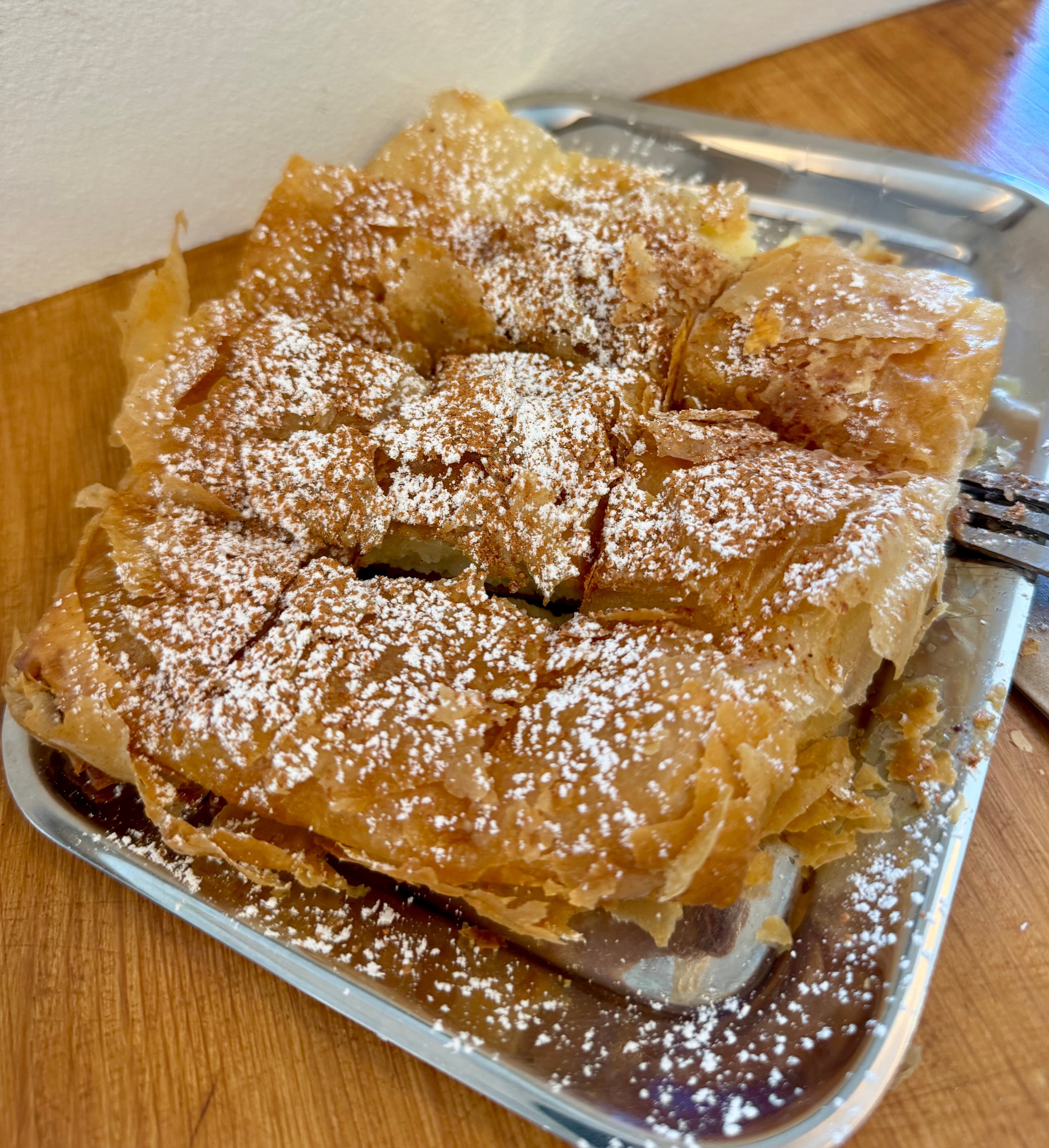 Bougatsa with cinnamon and powdered sugar, a delicious mental stop in Thessaloniki.