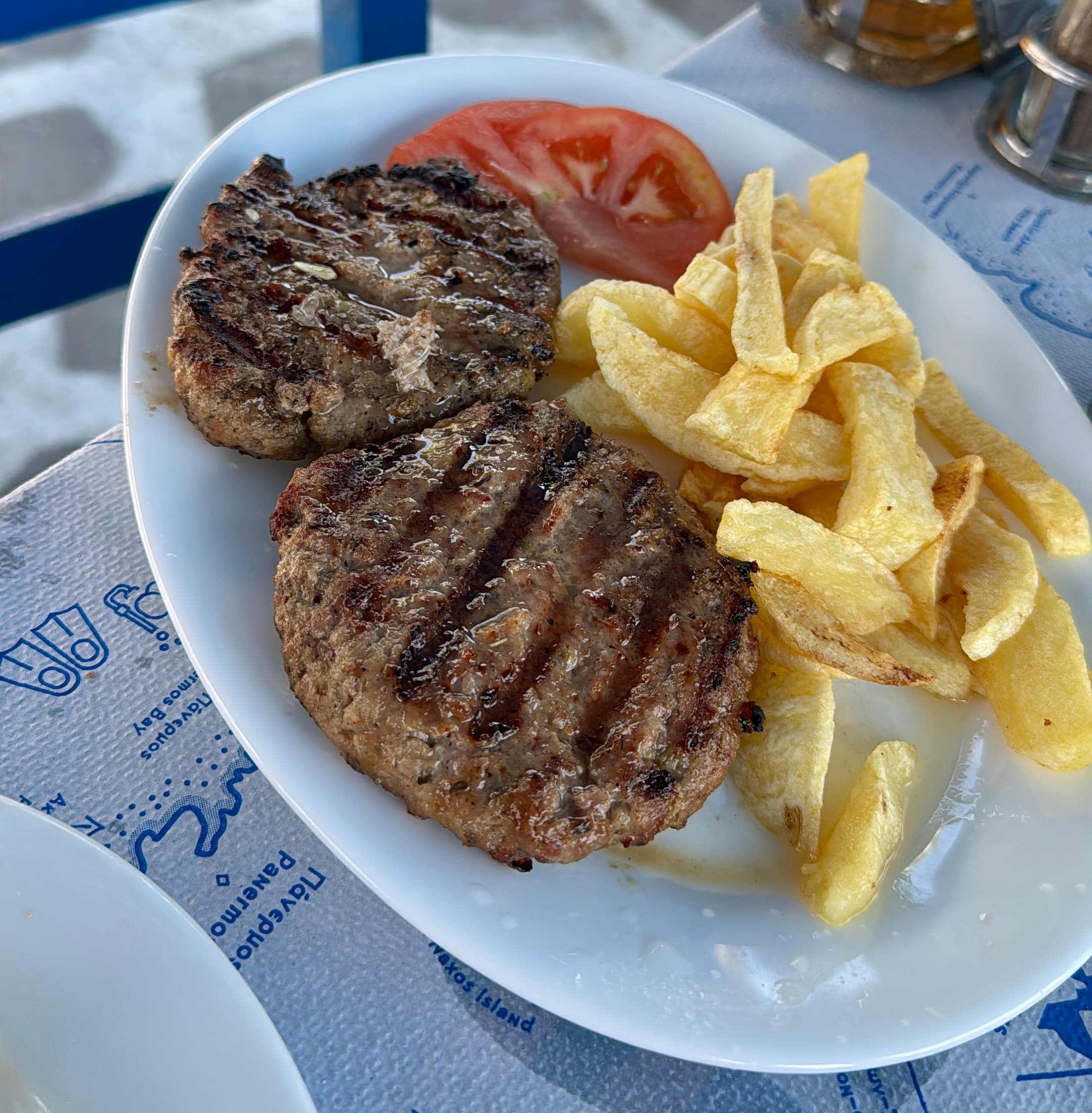 **Βifteki (μπιφτέκι)** with fresh fries.
